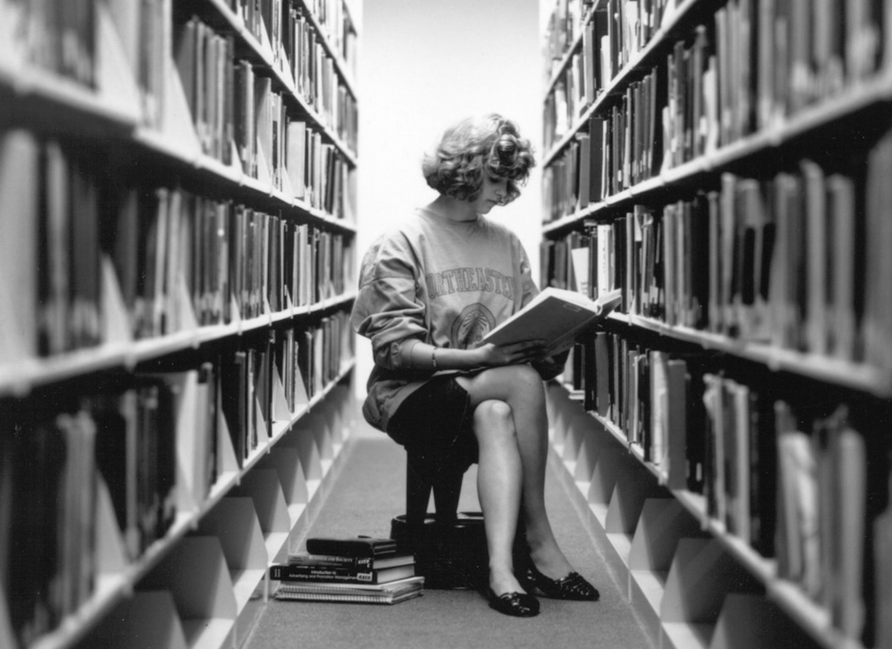 Snell Library, Patron Reading in the Stacks, ca. 1991.